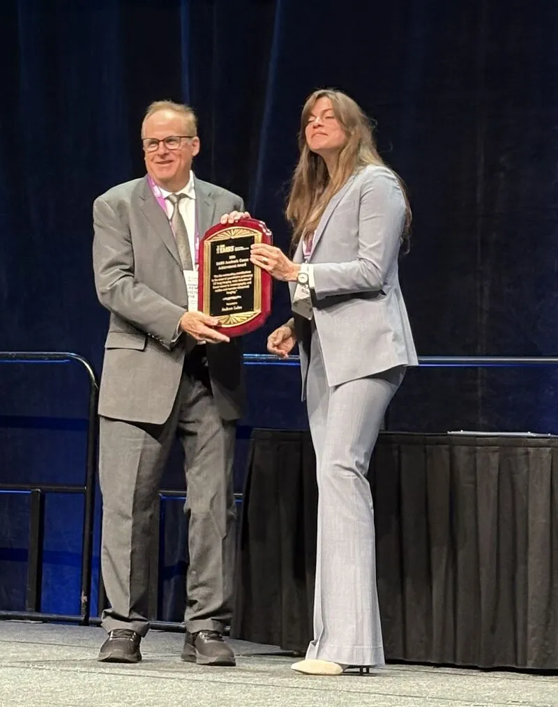 Laine Receives Award.jpeg